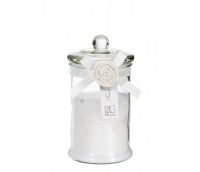 Scented candle in glass jar with a rose, white